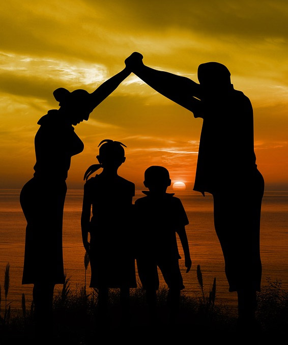 family enjoying a sunset image